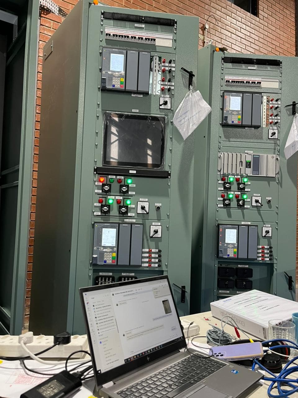 Two control panels connected for programming during factory acceptance test.