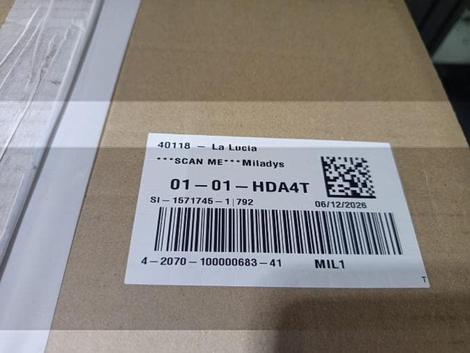 Carton with a printed barcode and QR label applied by the automated system