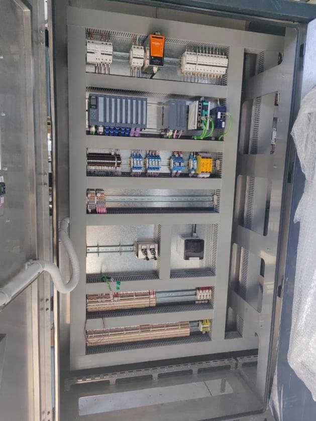 New stainless steel control panel with PLC I/O modules and neatly ducted wiring
