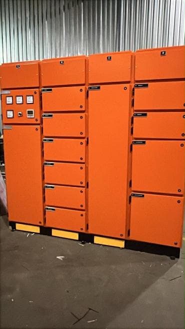 Finished orange feeder control panel with multiple labelled compartments